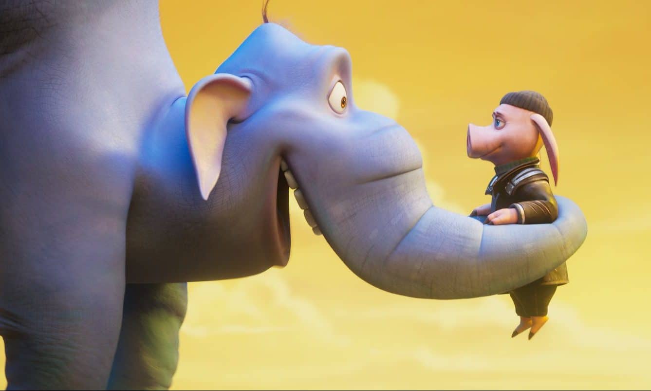 Két animációs figura látható a képen: egy elefánt és egy disznó. Az elefánt az ormányában tartja és a magasba emeli a disznót.